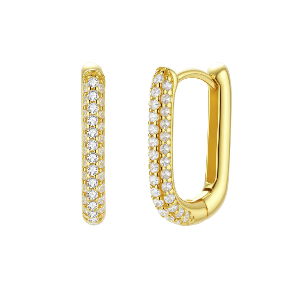 Close-up of small sterling silver huggie hoops completely covered in sparkling clear crystals with hinged closure