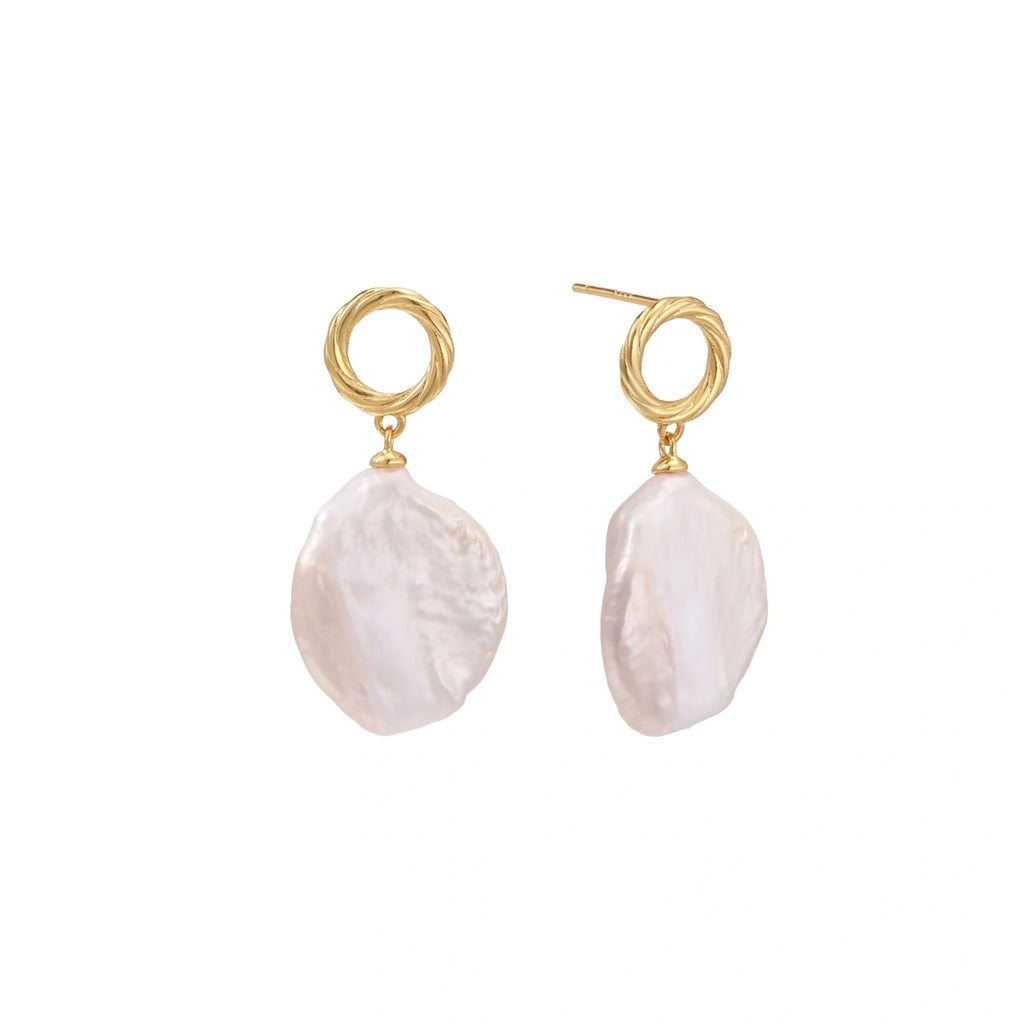 18K gold vermeil twisted circle studs with organic white baroque pearl drops on cream background