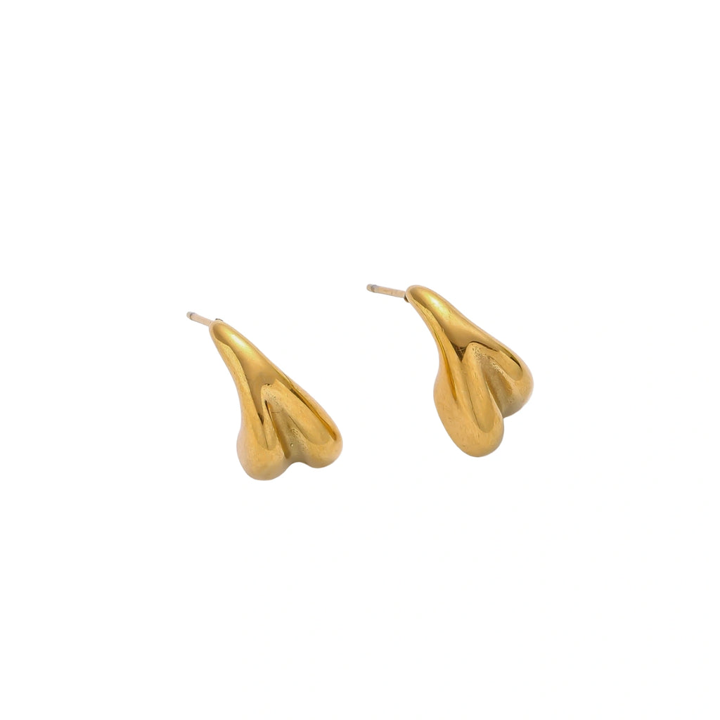 Organic sculptural gold stud earrings with fluid matte finish on cream background