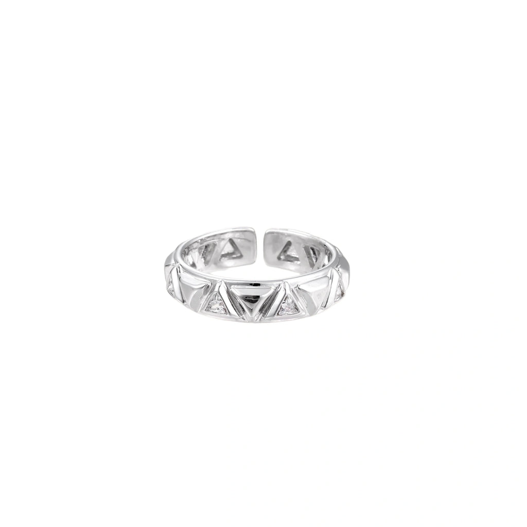 White gold adjustable ring with geometric triangle cutouts and zirconia stones on cream background