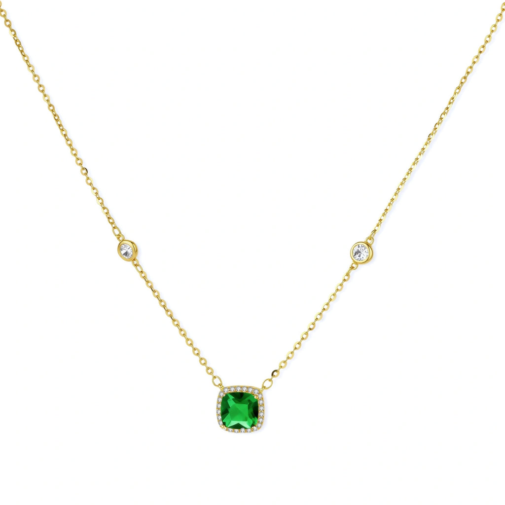 Delicate gold chain necklace featuring square emerald pendant with crystal halo and station accents