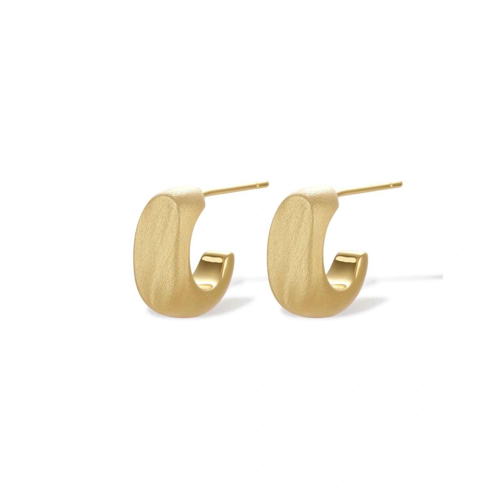 Small gold huggie earrings with matte finish, 14mm diameter, shown against cream background for everyday elegance.
