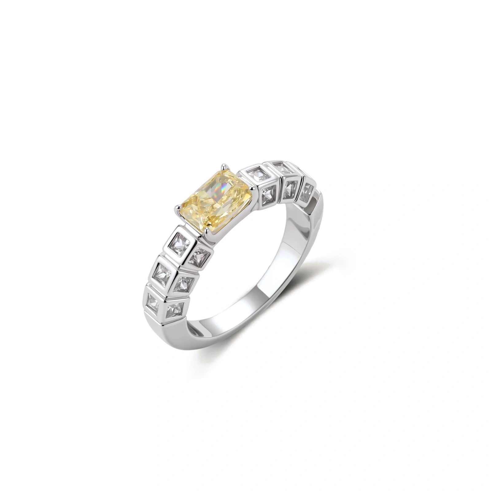 Adjustable ring with emerald-cut yellow zirconia center and clear accent stones in geometric platinum-plated setting